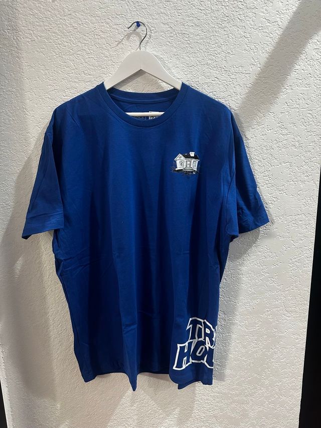 White Side Text on Blue Trap House